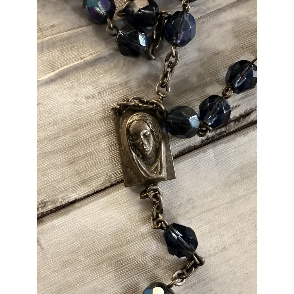 A vintage blue glass bead rosary with a silver-toned metal crucifix and medal. - Picture 3 of 10